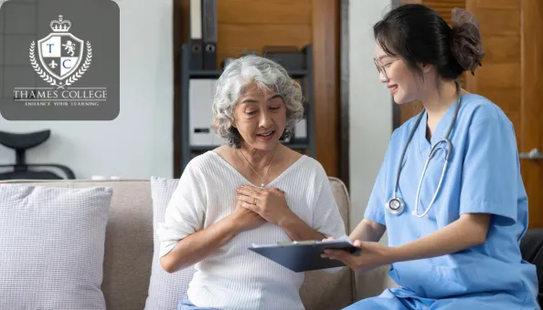 A smiling nurse in scrubs holds a clipboard and speaks with an elderly woman on a sofa in a calm, supportive environment; Thames College logo appears in the top-left corner.