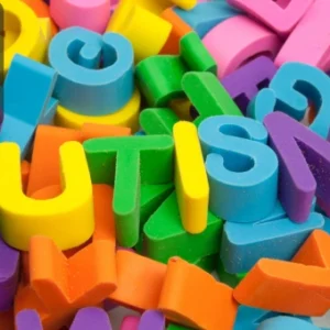 Colourful foam letters spelling the word "AUTISM," representing autism awareness and education.