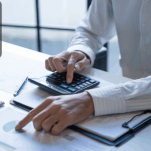 Person using a tablet and calculator while analysing financial charts on a desk, with the Thames College logo in the corner.