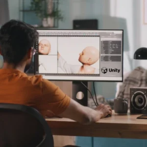 A person working on a computer, designing a 3D humanoid character in Unity.