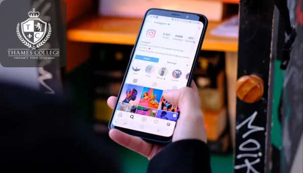 A person holding a smartphone displays an Instagram profile, with vibrant content and engagement metrics visible on screen. The Thames College logo is shown in the top-left corner.