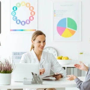 Healthcare professional consulting with a patient, representing reflexology practice and holistic wellness support.