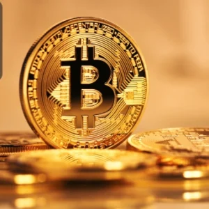 Close-up of golden Bitcoin coins, symbolising cryptocurrency adoption and digital payments for modern businesses.