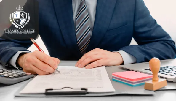 A businessman in a suit filling out legal forms at a desk, surrounded by office supplies, a stamp, and a calculator—symbolising the connection between law and business analysis.