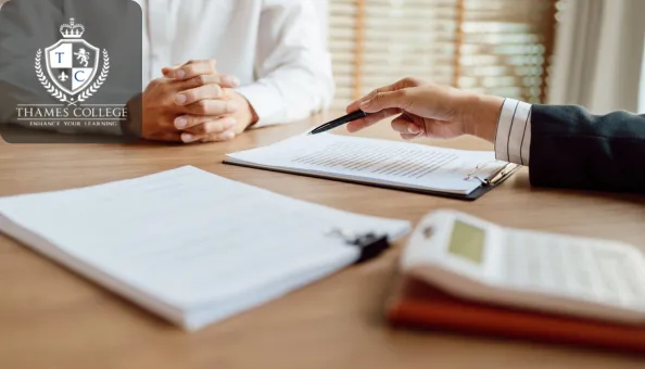 A professional reviewing an insurance policy with a client, emphasising the importance of risk management in securing the right coverage.