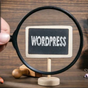 Basic WordPress course concept with magnifying glass focusing on WordPress sign on a desk.