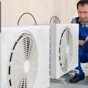 An HVAC technician inspecting and maintaining air conditioning units, ensuring efficient operation of heating, ventilation, and cooling systems.