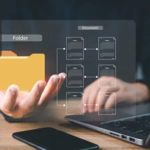 Person using a laptop with a digital overlay showing a folder and interconnected document icons, representing document control.