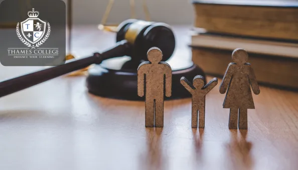 Wooden cutout figures of a family with a gavel and law books in the background symbolising family law and legal protection.