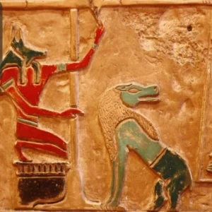 Ancient Egyptian wall carving with colourful depictions of gods and mythical figures, representing the civilisation’s culture and history.