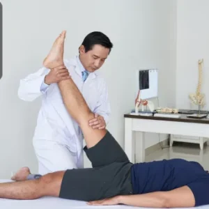 A physiotherapist performing a leg stretch on a patient as part of a Physiotherapy and Pain Management treatment.