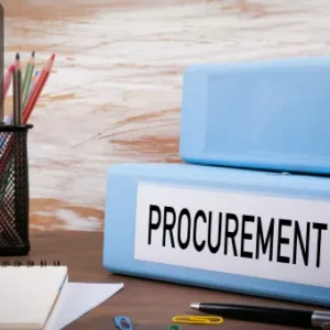 Two blue office binders labelled "PROCUREMENT" placed on a desk alongside stationery items, with the Thames College logo in the top left corner.