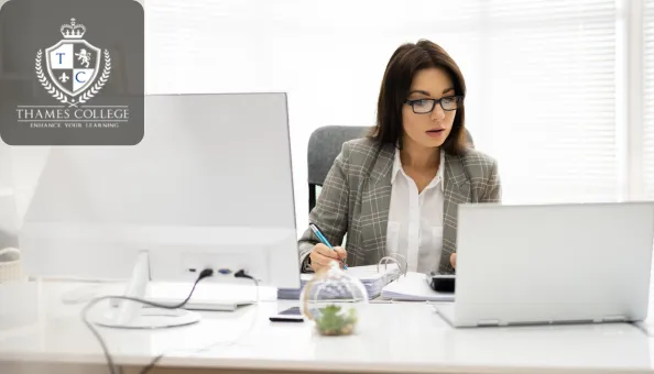 A professional working on Xero accounting software and bookkeeping tasks on a laptop, reviewing financial documents.