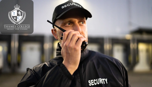Security officer in uniform using a walkie-talkie, symbolising organisational security management and risk control.